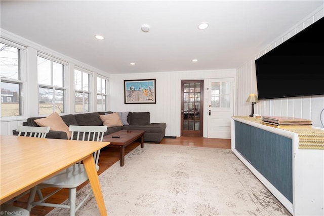 living room featuring light wood-style flooring and recessed lighting