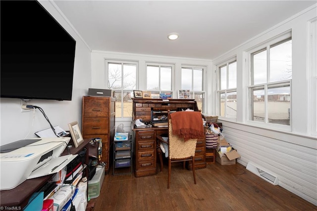 office space with visible vents, crown molding, and wood finished floors