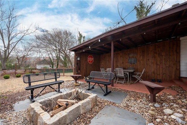 view of patio / terrace with outdoor dining space and fence