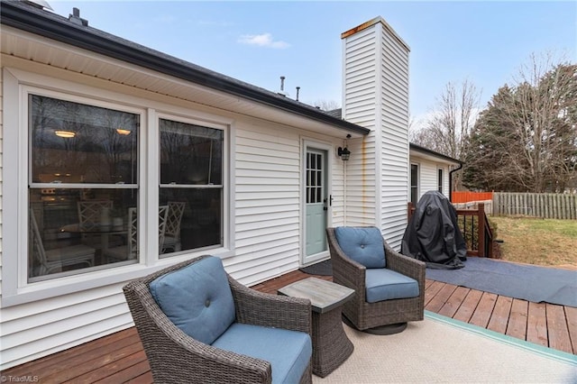 wooden deck featuring fence