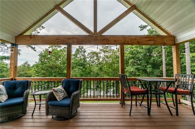 wooden terrace featuring outdoor dining area