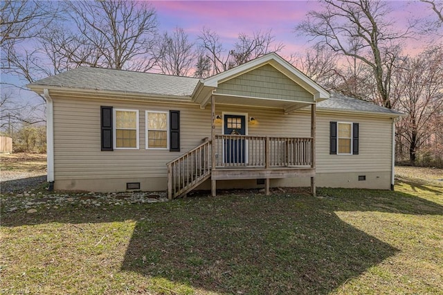 view of front of house featuring crawl space, covered porch, a front yard, and roof with shingles