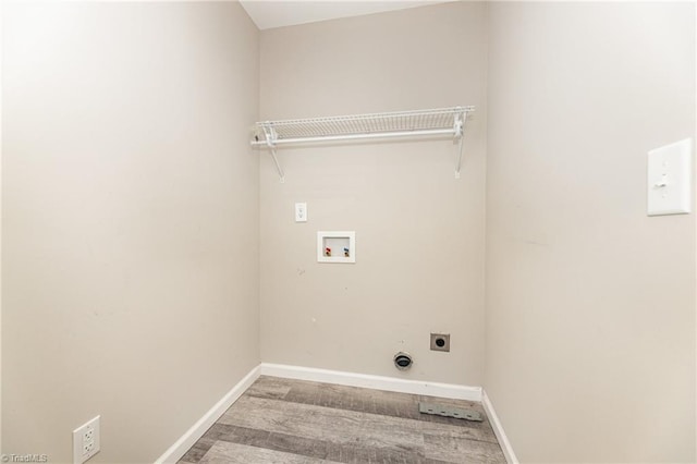 washroom featuring laundry area, hookup for a washing machine, electric dryer hookup, and baseboards