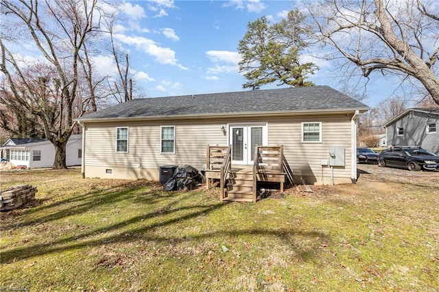 rear view of house with roof with shingles, a wooden deck, a yard, french doors, and crawl space