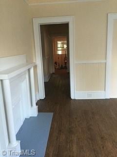 hallway featuring dark hardwood / wood-style flooring