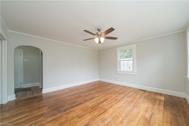 4065 Leo St, Winston-Salem, NC 27105 - unfurnished room with hardwood / wood-style flooring, ceiling fan, arched walkways, baseboards, and ornamental molding