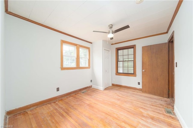 4065 Leo St, Winston-Salem, NC 27105 - unfurnished bedroom with ornamental molding, baseboards, light wood finished floors, a closet, and ceiling fan