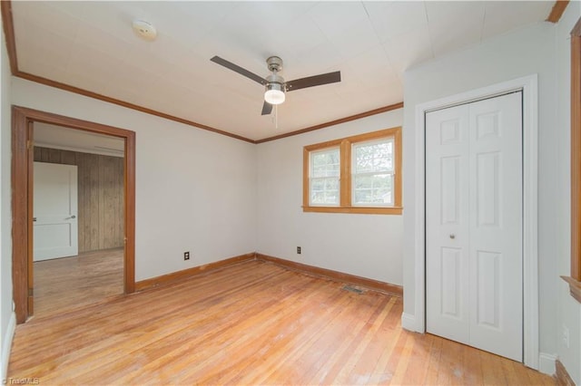 4065 Leo St, Winston-Salem, NC 27105 - unfurnished bedroom featuring light wood-type flooring, baseboards, crown molding, a closet, and ceiling fan