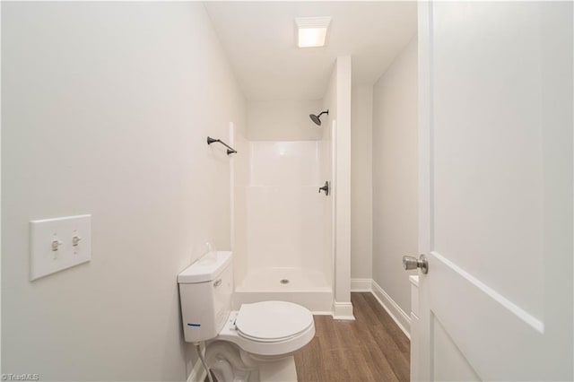 4065 Leo St, Winston-Salem, NC 27105 - full bathroom featuring a shower, wood finished floors, toilet, and baseboards