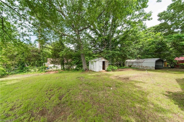 4065 Leo St, Winston-Salem, NC 27105 - view of grassy yard featuring a detached carport