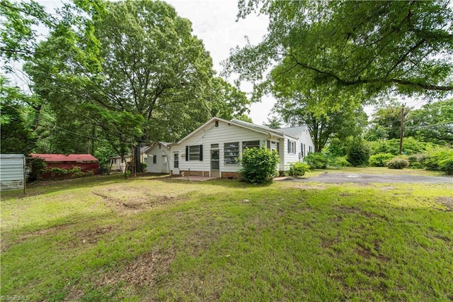 4065 Leo St, Winston-Salem, NC 27105 - view of green lawn featuring driveway and view of wooded area