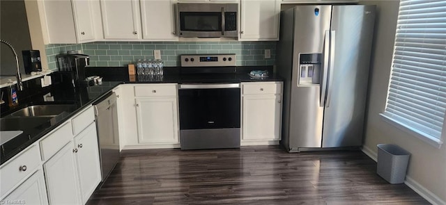 kitchen featuring stainless steel appliances and white cabinets