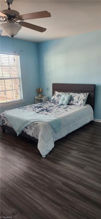 bedroom featuring dark wood-style floors and ceiling fan