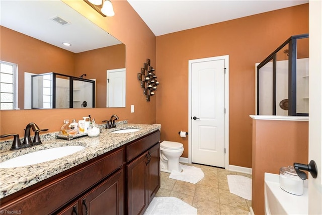 2711 Chari Park Ln, Walkertown, NC 27051 - full bath with a shower stall, toilet, double vanity, tile patterned floors, and baseboards