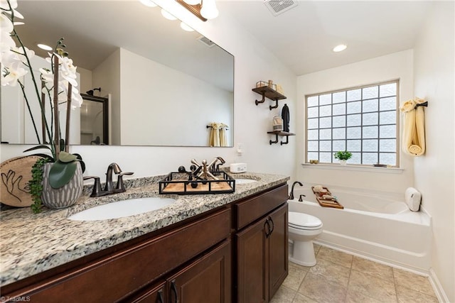 2711 Chari Park Ln, Walkertown, NC 27051 - bathroom featuring a garden tub, double vanity, toilet, and a shower