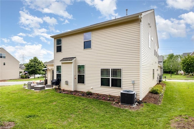 2711 Chari Park Ln, Walkertown, NC 27051 - back of property featuring an outdoor hangout area, central AC, and a yard