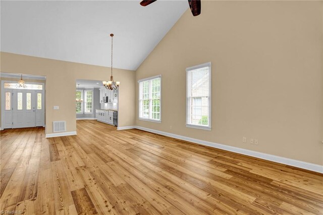 hallway with light wood-type flooring and crown molding