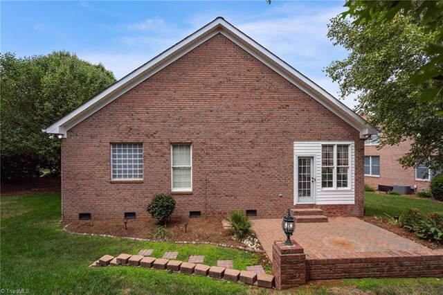 view of home's exterior featuring a lawn and a garage