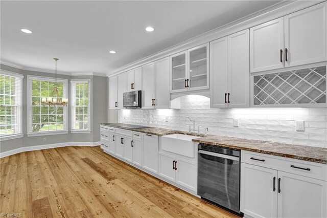 kitchen featuring white cabinets and light hardwood / wood-style flooring