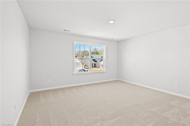 spare room featuring carpet flooring