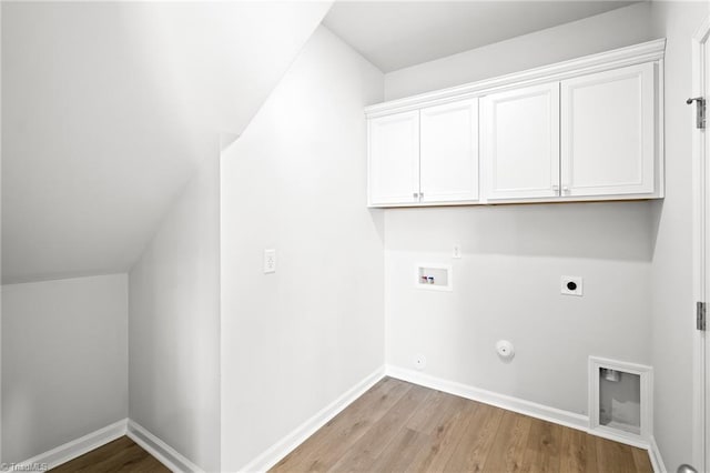 laundry room featuring cabinets, light wood-type flooring, washer hookup, hookup for an electric dryer, and hookup for a gas dryer