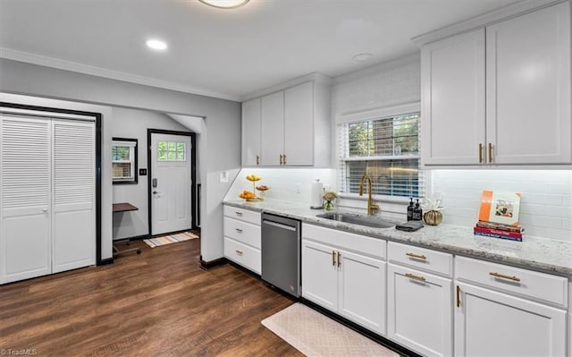 1449 NC Highway 150 W, Summerfield, NC 27358 - kitchen with stainless steel dishwasher, dark wood finished floors, decorative backsplash, crown molding, and white cabinetry