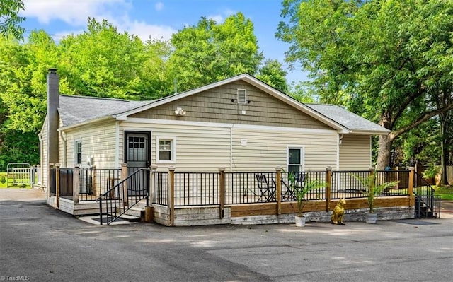 1449 NC Highway 150 W, Summerfield, NC 27358 - view of front of home with a chimney and a shingled roof