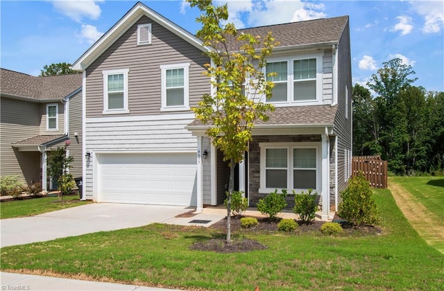 view of front of house with a garage and a front yard