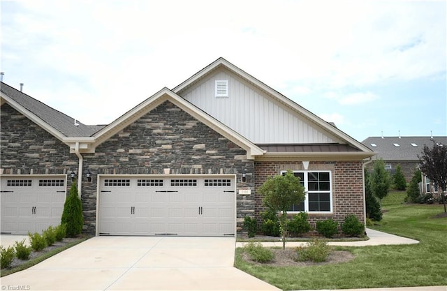 view of front of home featuring a garage and a front lawn