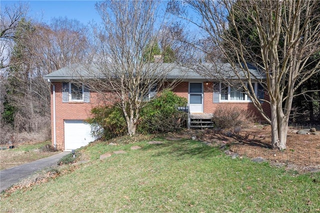 ranch-style house featuring aphalt driveway, a front yard, brick siding, and an attached garage