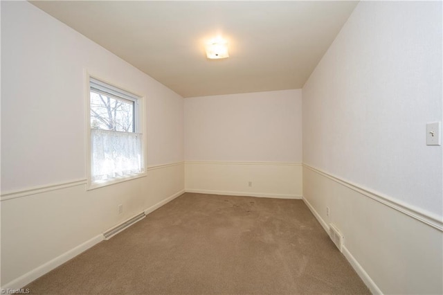 unfurnished room featuring visible vents, baseboards, and carpet flooring