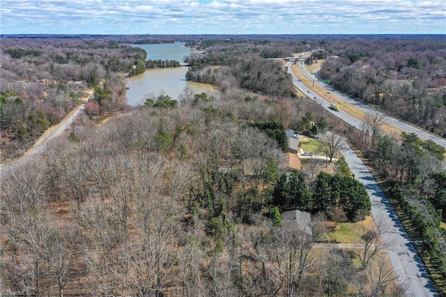 aerial view with a view of trees and a water view