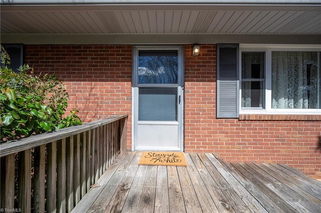 entrance to property with brick siding