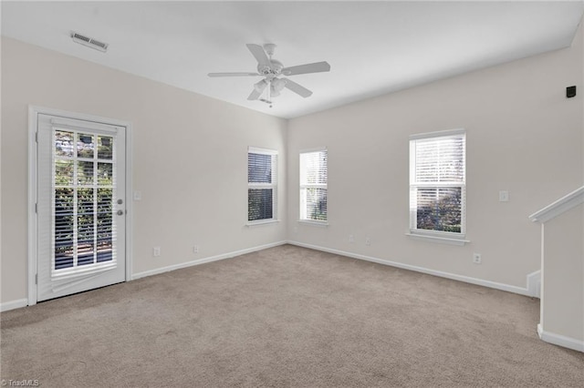 unfurnished room featuring ceiling fan and light colored carpet