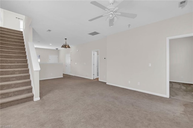 unfurnished living room with carpet and ceiling fan