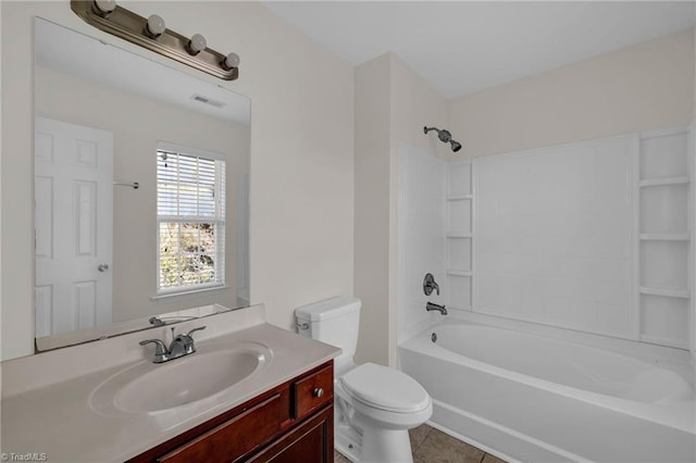 full bathroom featuring vanity, tile patterned flooring, toilet, and washtub / shower combination