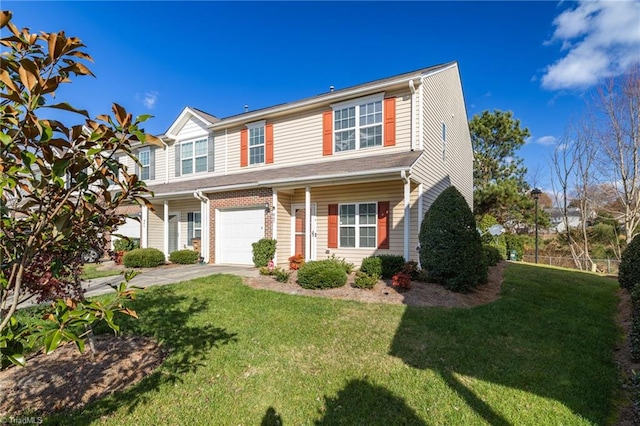 view of front of property featuring a garage and a front yard