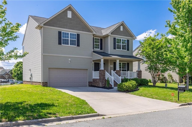 craftsman house with an attached garage, concrete driveway, a porch, and a front yard