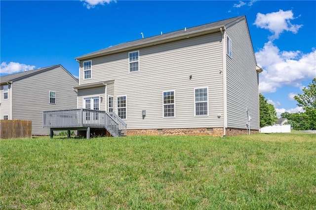 back of house with a yard, a deck, and crawl space