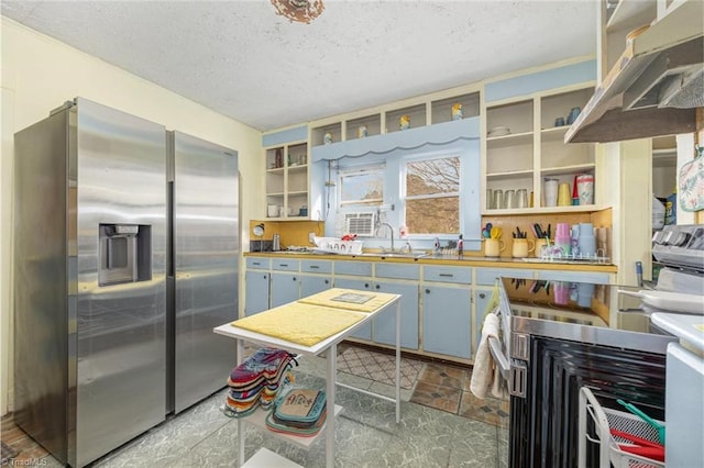 kitchen with open shelves, under cabinet range hood, stainless steel refrigerator with ice dispenser, a textured ceiling, and a sink