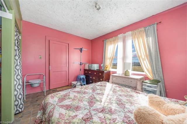 bedroom featuring a textured ceiling