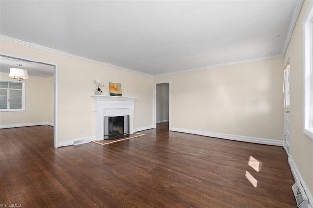 unfurnished living room with crown molding and dark hardwood / wood-style floors