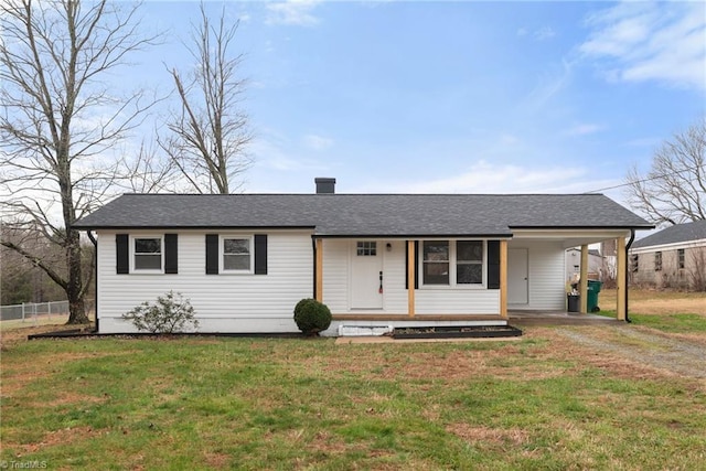 view of front of property with driveway, a shingled roof, a porch, a carport, and a front yard