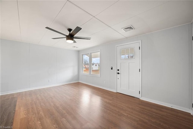 entrance foyer with dark wood-style floors, baseboards, visible vents, and a ceiling fan