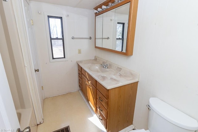 full bathroom featuring tile patterned floors, visible vents, toilet, and vanity