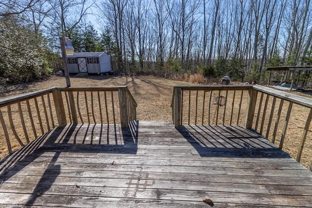 deck with a storage unit and an outdoor structure