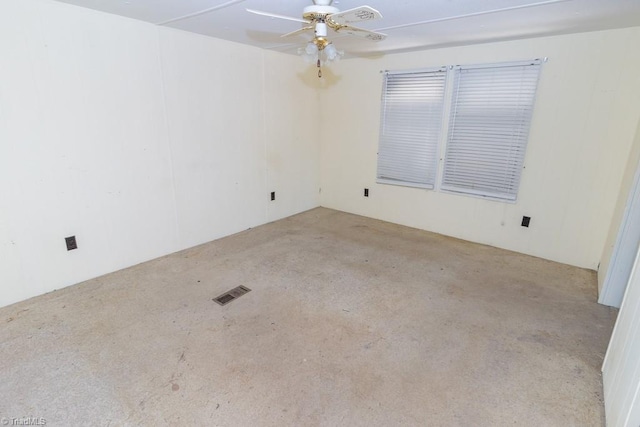 empty room with a ceiling fan and visible vents