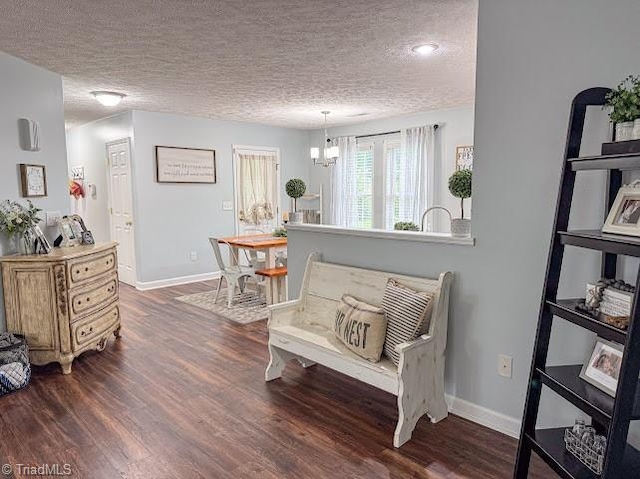 525 Bennett St, Mount Airy, NC 27030 - sitting room with a textured ceiling, dark wood-style floors, and baseboards