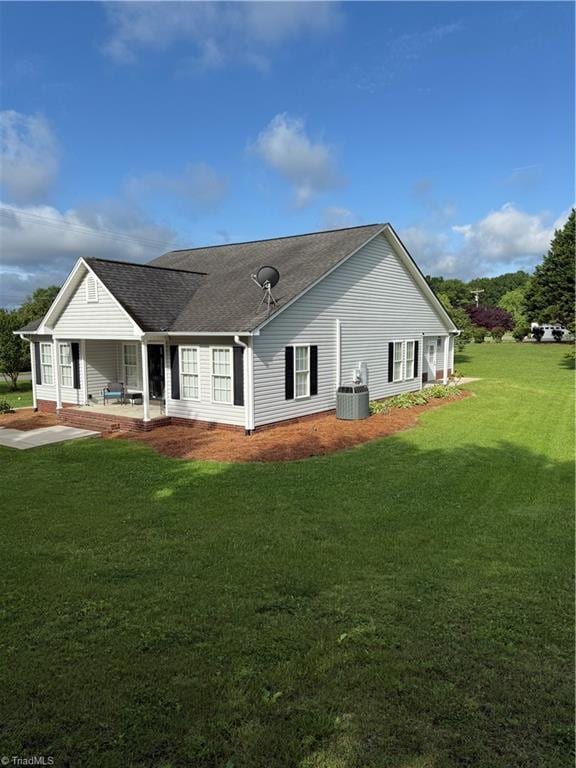 525 Bennett St, Mount Airy, NC 27030 - rear view of house with a yard, cooling unit, and a shingled roof
