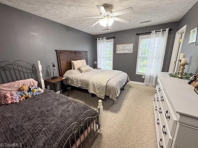 525 Bennett St, Mount Airy, NC 27030 - bedroom featuring a textured ceiling, carpet, a ceiling fan, and baseboards